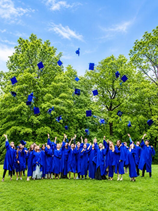 Graduates Toss Caps In The Park
